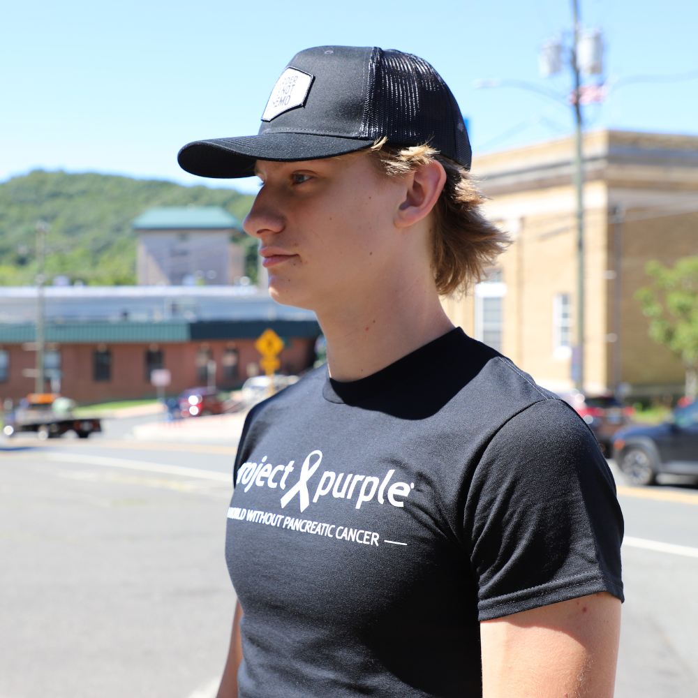 boy with black project purple shirt