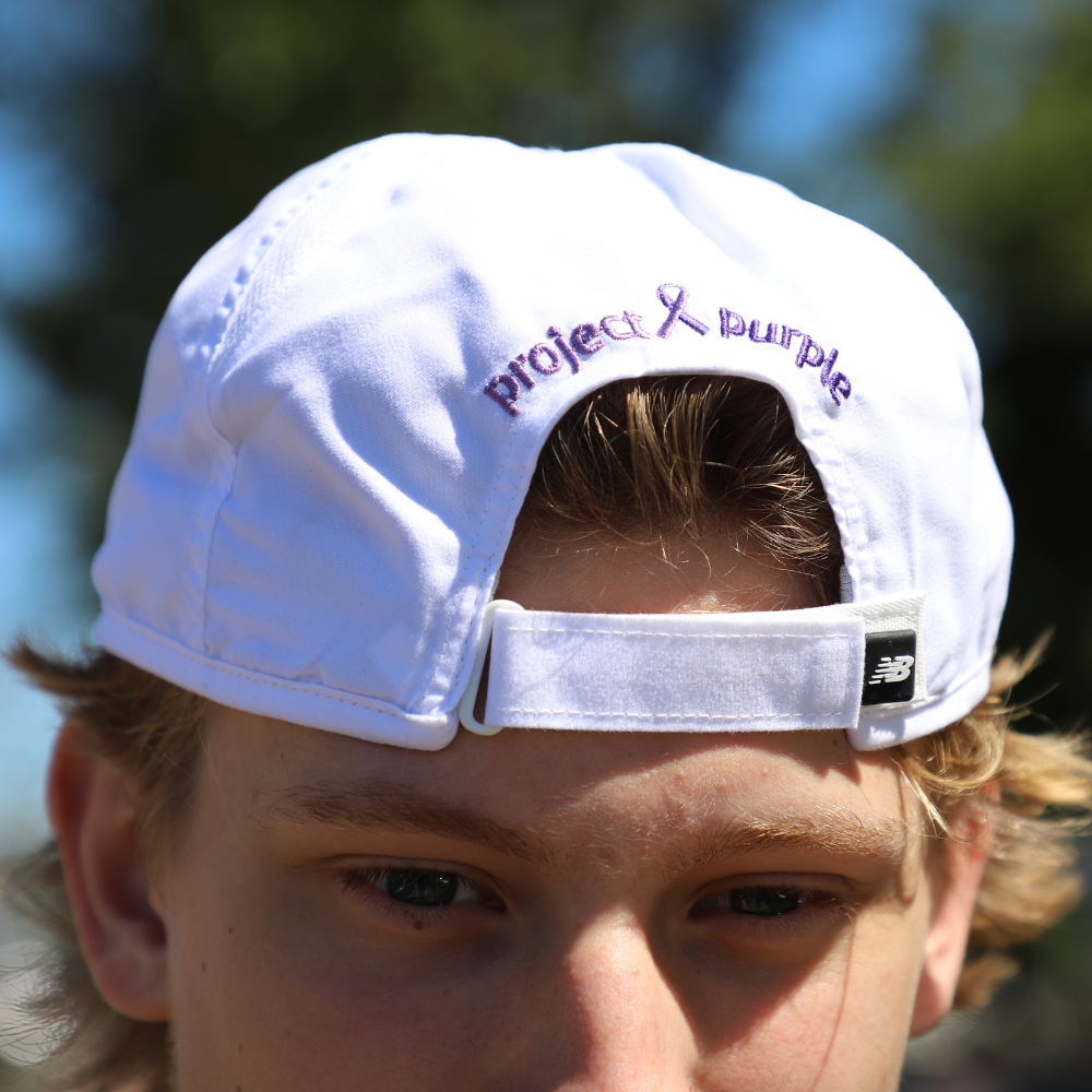 boy with backwards white hat