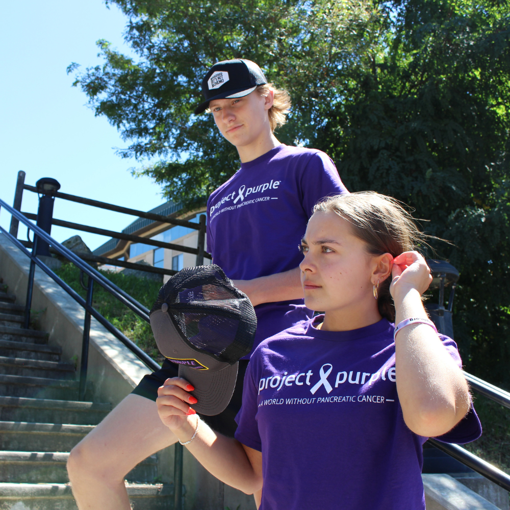 boy and girl with project purple shirts