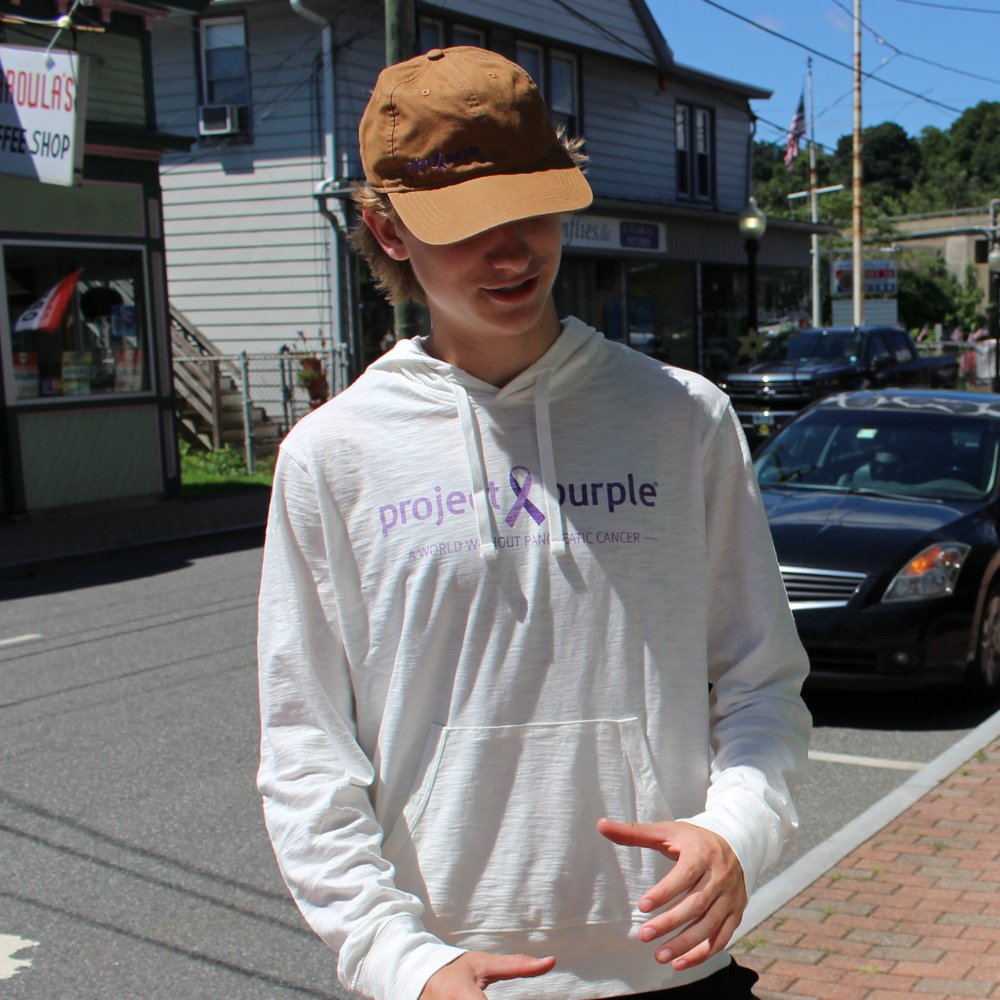 boy with  white long sleeve hoodie shirt