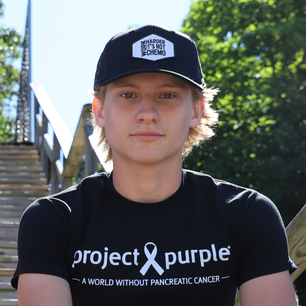 front view of boy with black hat