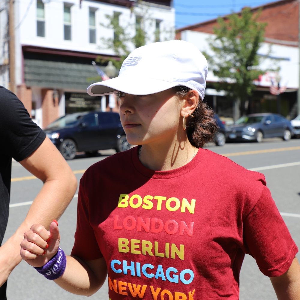 girl with red project purple shirt