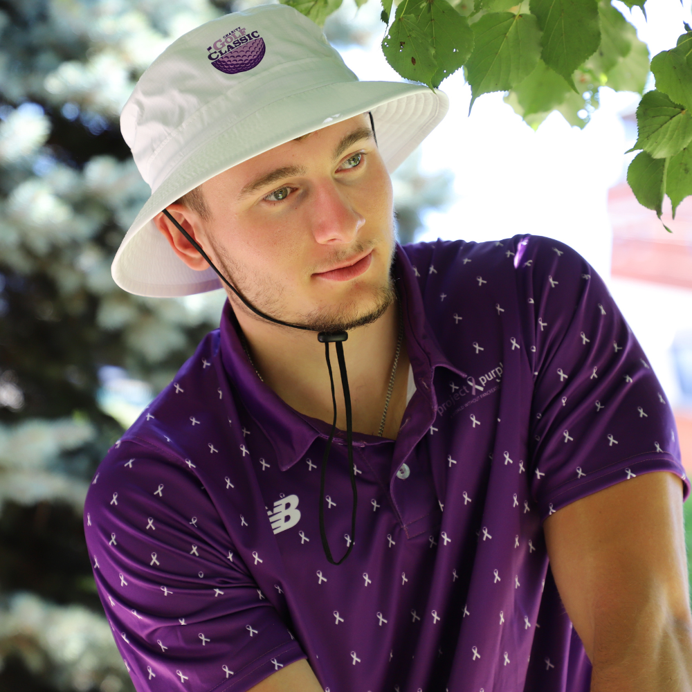 boy with purple golf polo