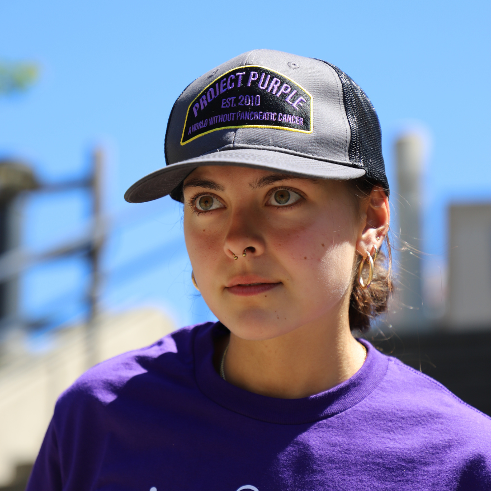 girl with black project purple hat