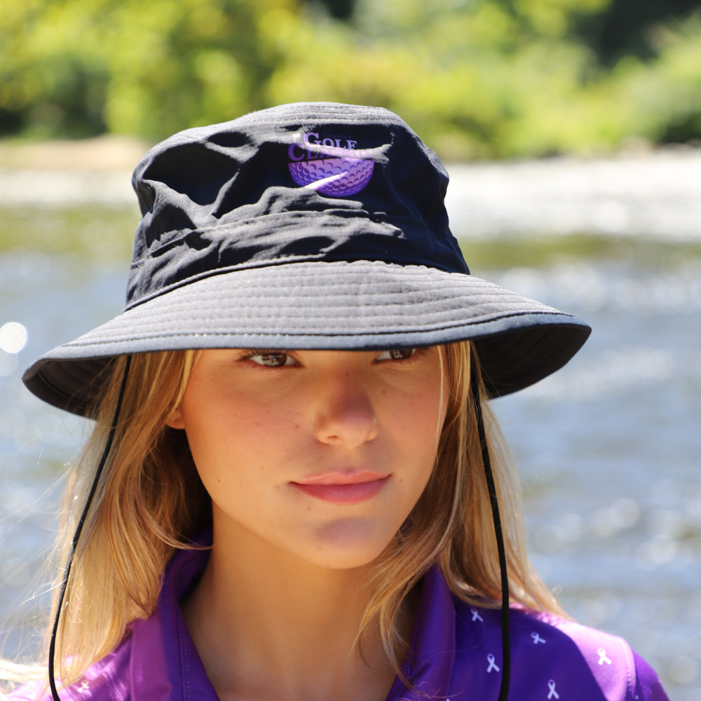 close up of girl with black bucket hat