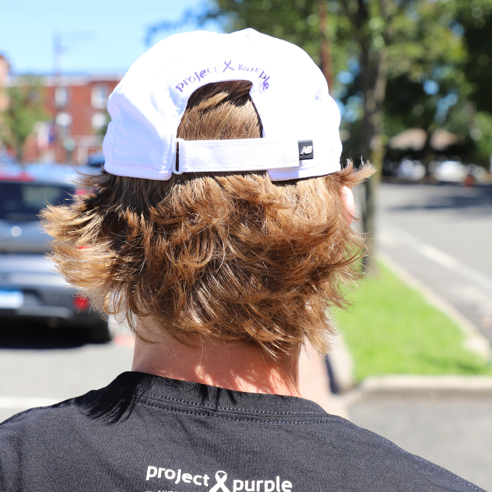 back view of white new balance hat