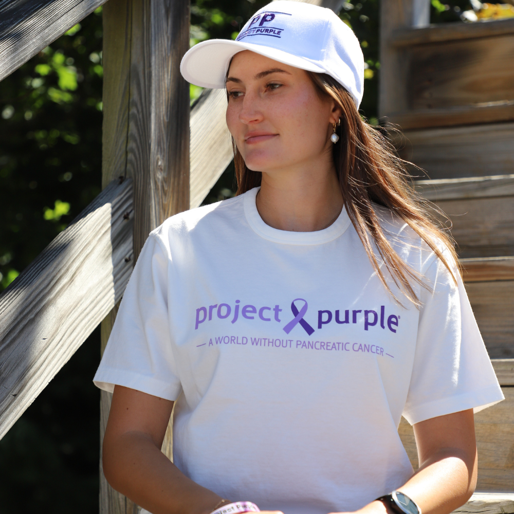 girl on stairs with white hat and shirt