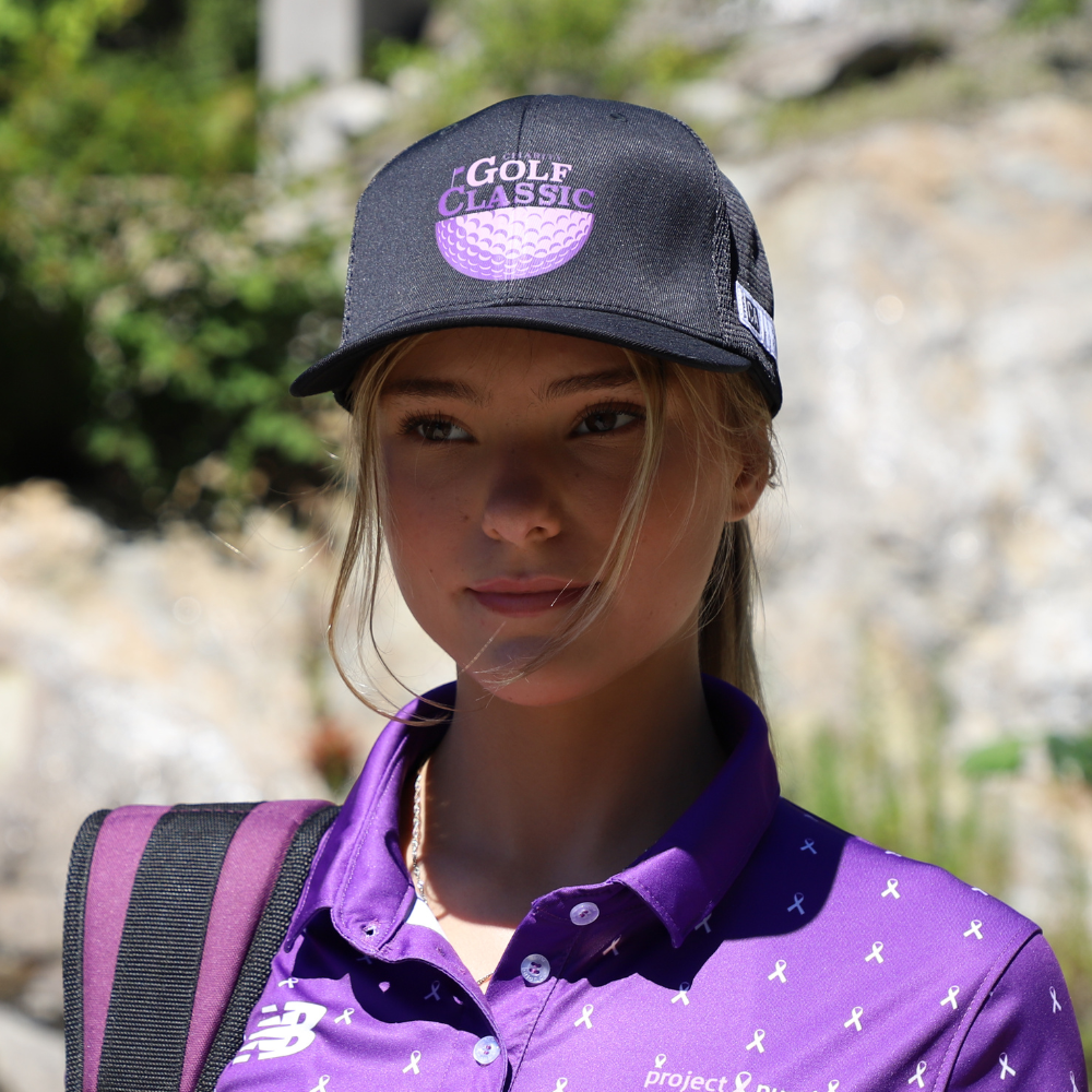 front view of girl with black golf hat