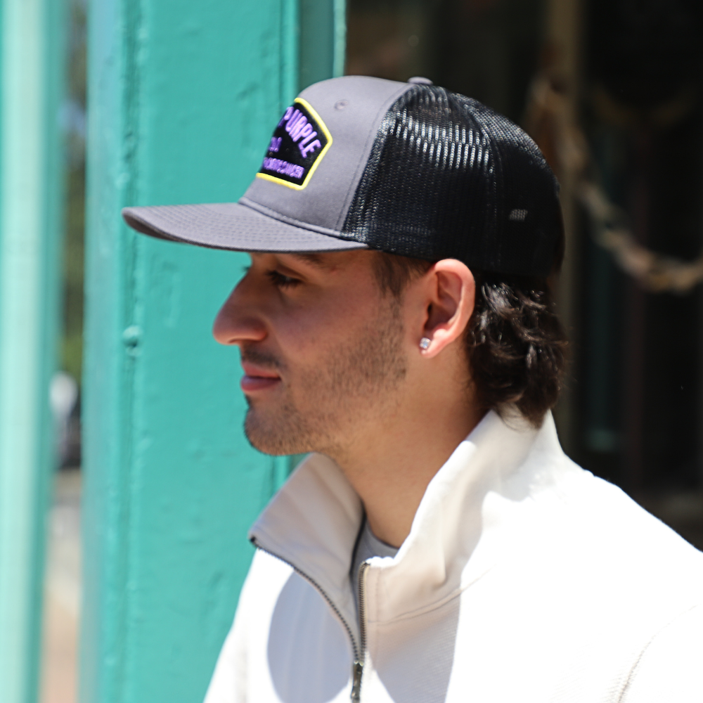 side view of boy with black hat