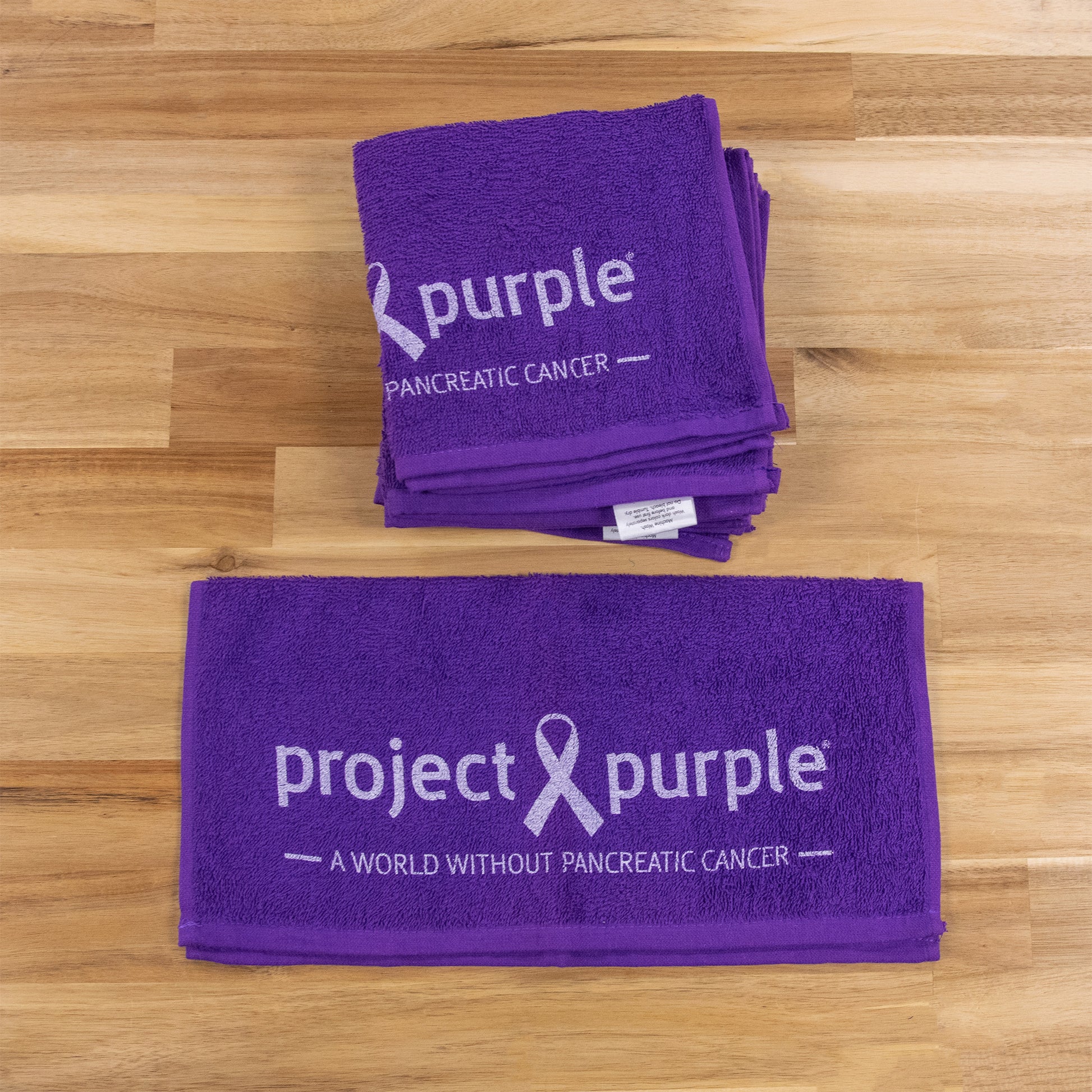 top view purple towel with logo