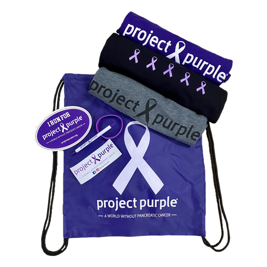 Project Purple cinch bag with three shirts sticker magnet pen and bracelet