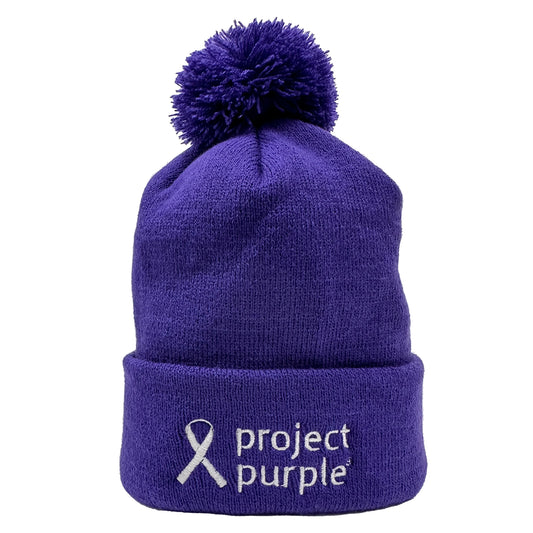Purple beanie with Project Purple Logo and pom pom