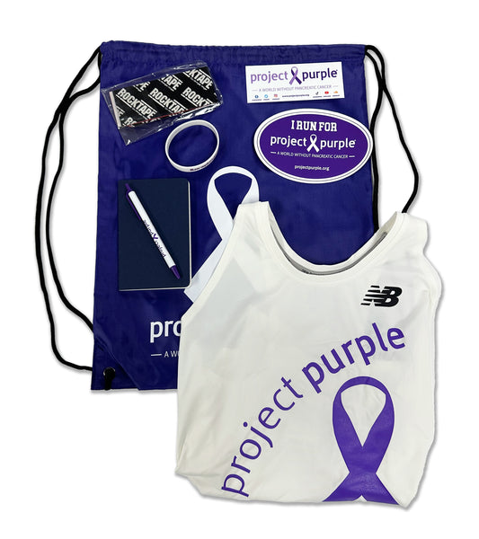 Project purple draw string bag with singlet and running supplies for marathon